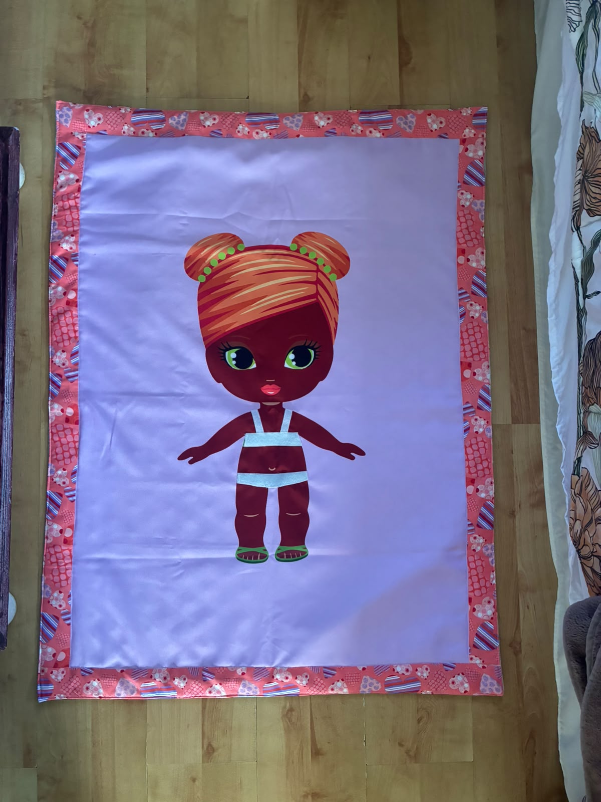 Dress-up doll blanket with doll character and outfit pieces