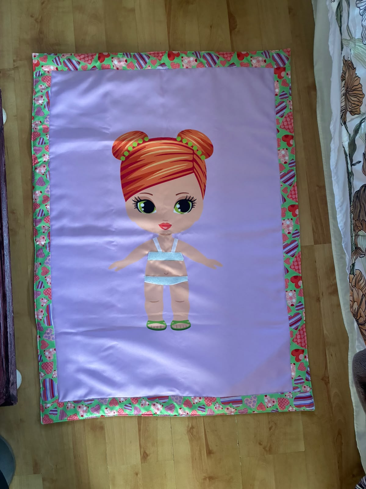 Dress-up doll blanket with green and pink trim